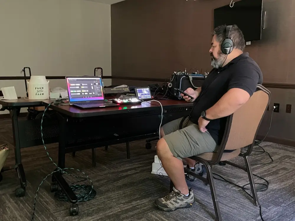 Video production crew monitoring a multimedia recording session at an Auburn Hills tech center